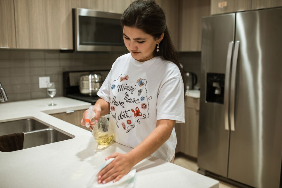 Detailing and wiping a modern kitchen counter